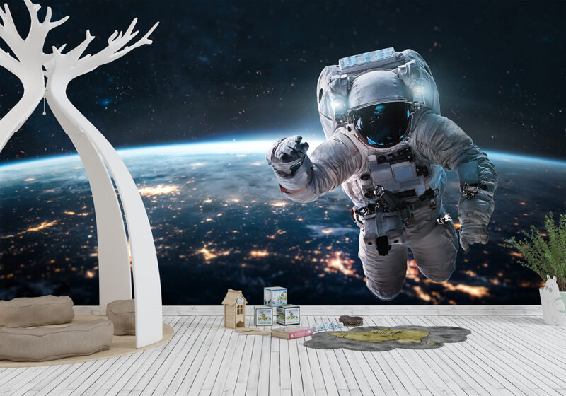 Foto tapeta Astronaut nad svetlima gradova na zidu